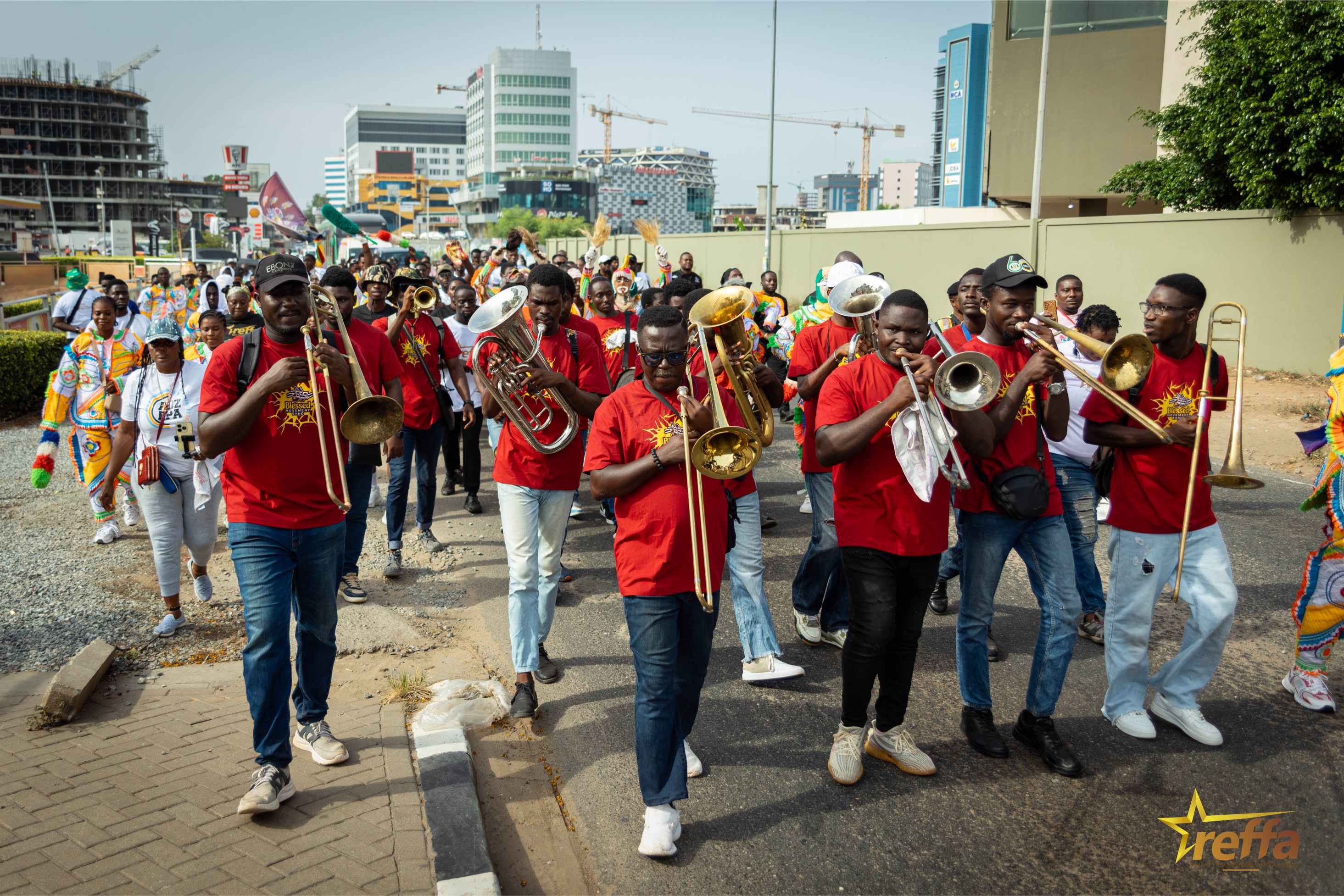 Brass band leading the REFFA health walk through Accra